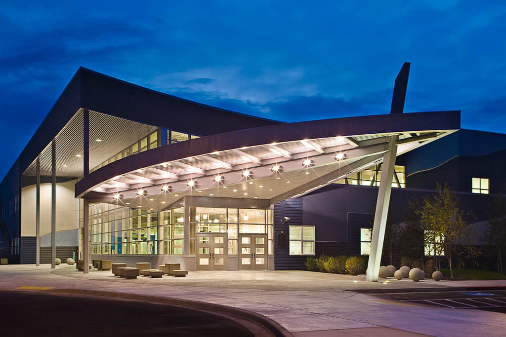 Exterior of the Career Tech High School lit up at night