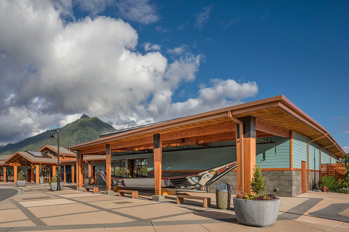 Exterior view of the Harrigan Centennial Hall with traditional canoe art installation.