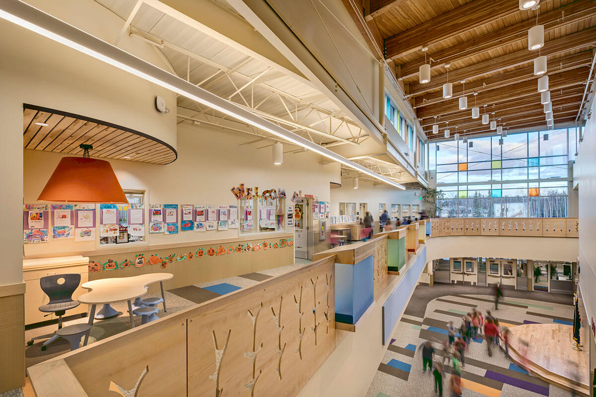 Hallway inside of the Iditarod Elementary School with foyer visible below.