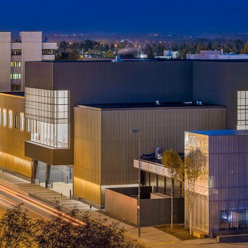 Exterior view at night of the Anchorage Museum Expansion
